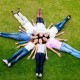 Group of people laying in a circle